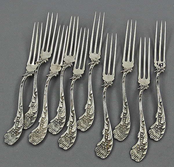 Ten Durgin sterling silver antique strawberry forks