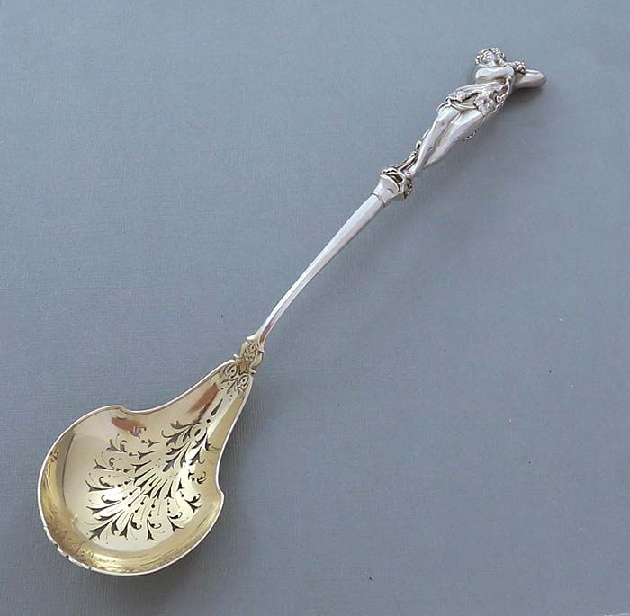 Caldwell antique Sterling pierced spoon with neo classical figurine handle