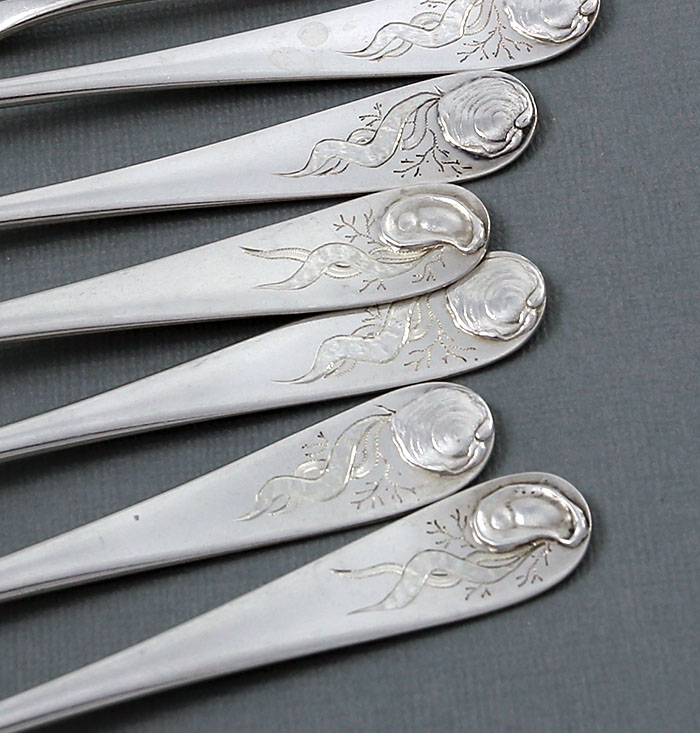 set of twelver sterling oyster forks by Durgin with applied oyster