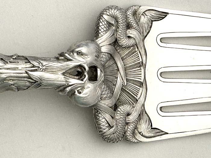 detail of English antique silver fish set in custom box