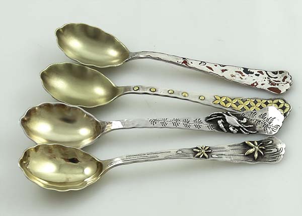 Tiffany antique coffee spoons with silver gilt and multiple metals application circa 1880