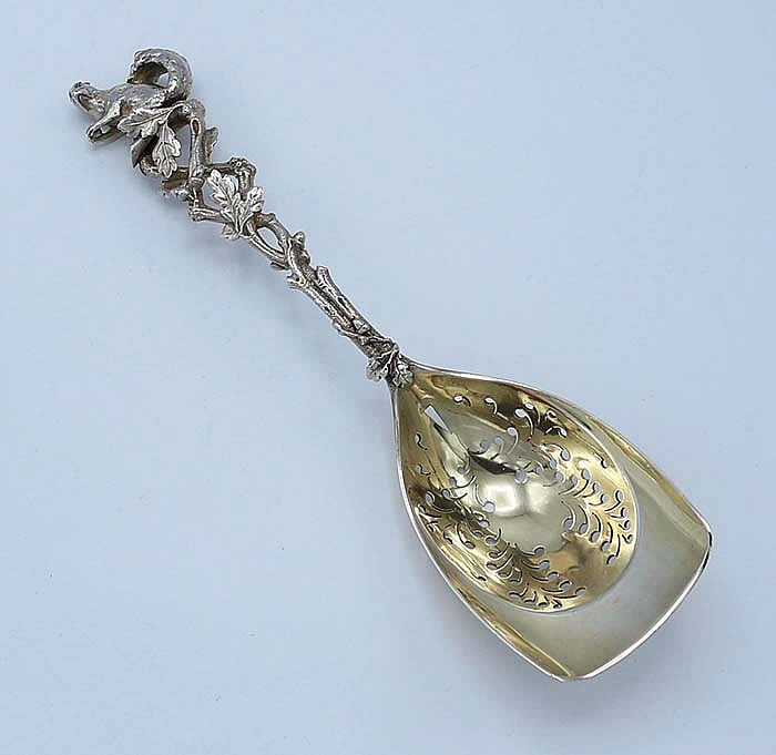 Large Tiffany cast sterling spoon with squirrel terminal and pierced bowl