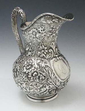 antique American sterling repousse pitcher