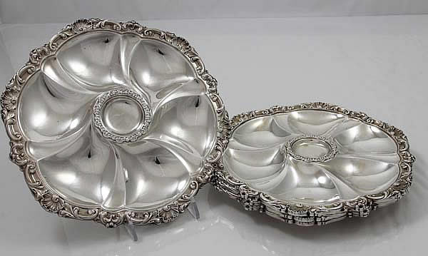 Four antique sterling oyster plates by Howard and Company