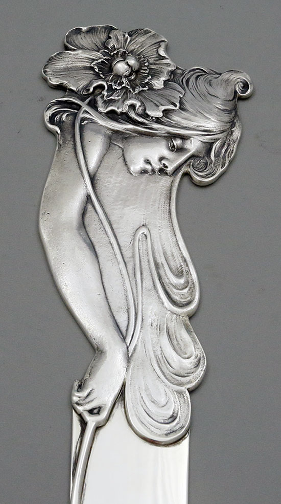 detail of art nouveau face on Graff Washbourne and Dunn paper knife circa 1903