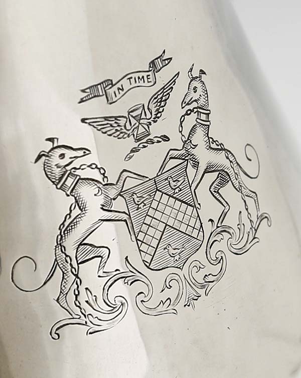 crest on antique silver chocolate pot