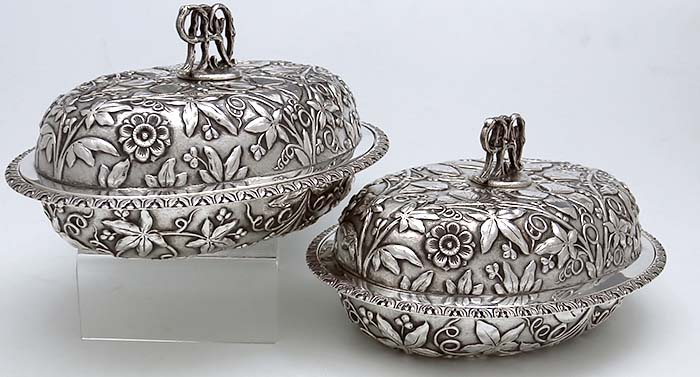 W H Saxton Sterling pair of covered vegetable dishes with chased butterflies and custom monogrammed finial handle