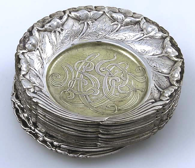 Set of 12 Tiffany ornate butter pats with acid etched monogram