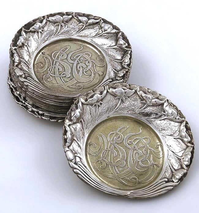 Set of 12 Tiffany ornate butter pats with acid etched monogram