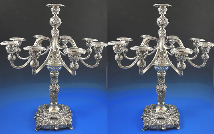 Pair Tiffany repousse sterling nine light candelabra