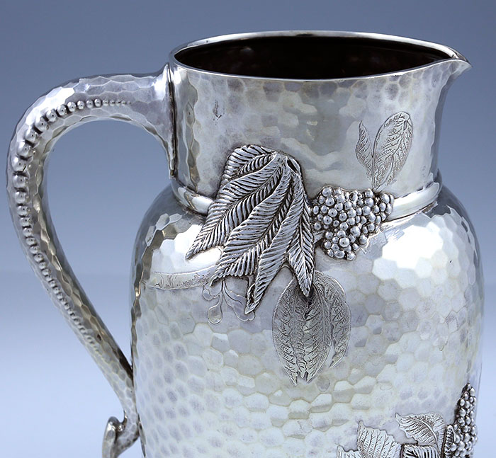 Tiffany hand hammered sterling silver pitcher with acid etched and applied decoration