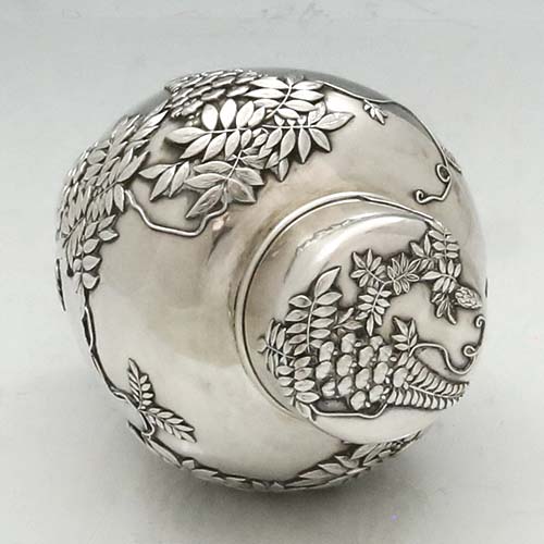 top of Japanese antique silver tea caddy with wisteria